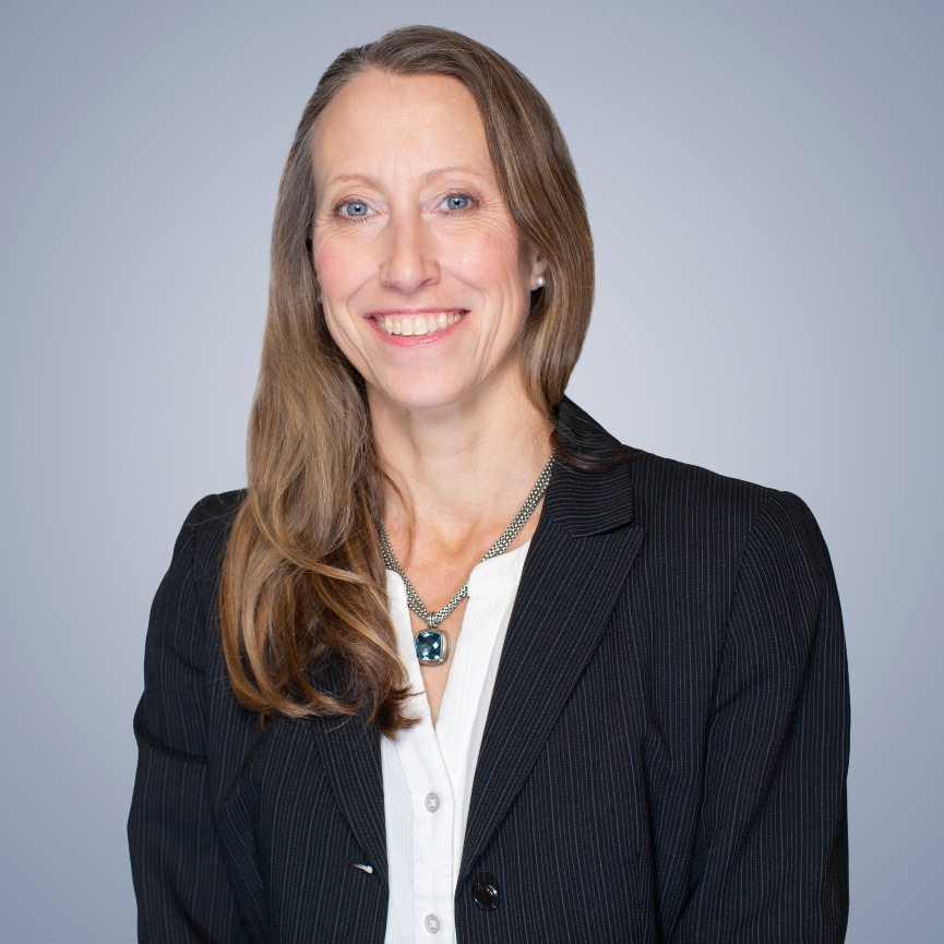 Dr. Kim Dennis headshot, smiling at camera